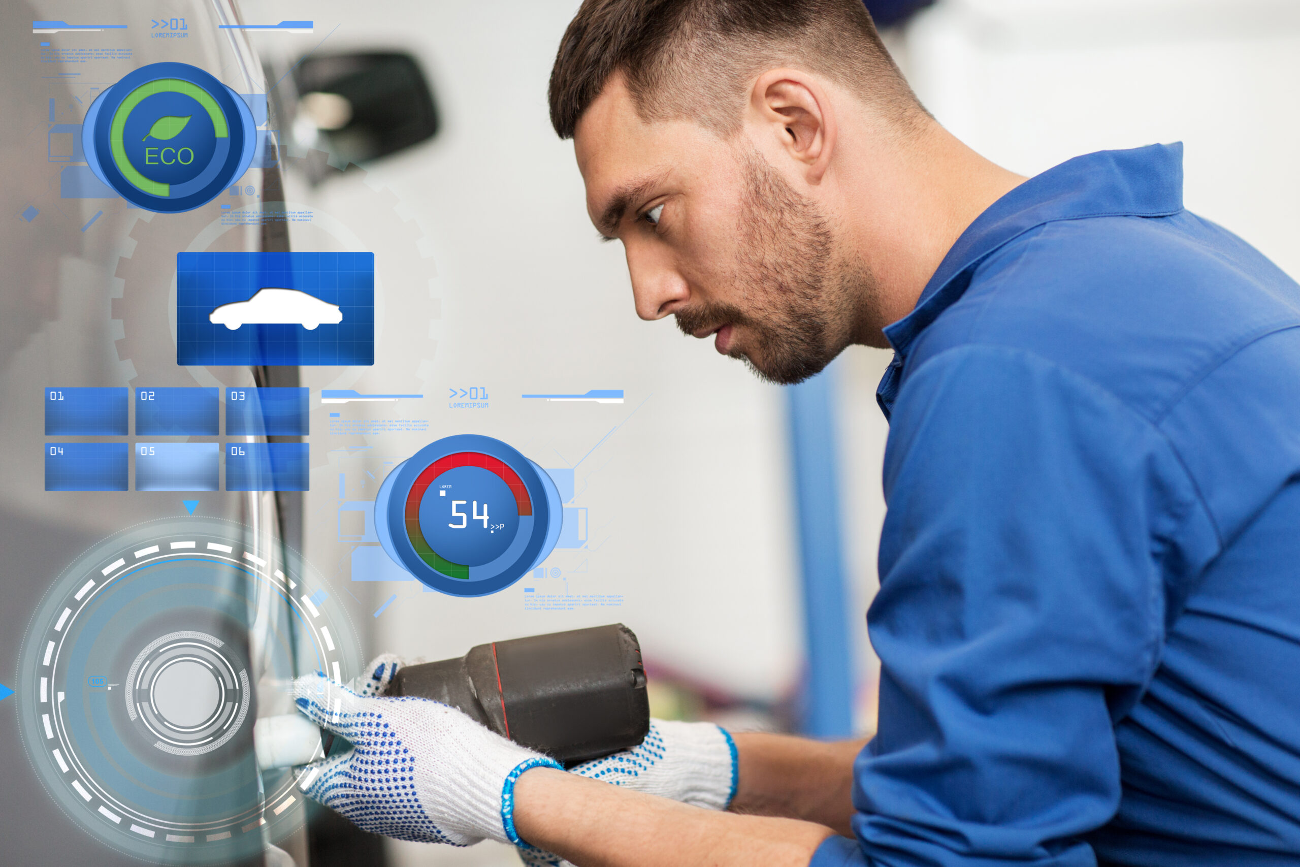 Technician using diagnostic scanner on car electrical system
